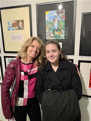 Student and woman at Word and Image exhibition 
